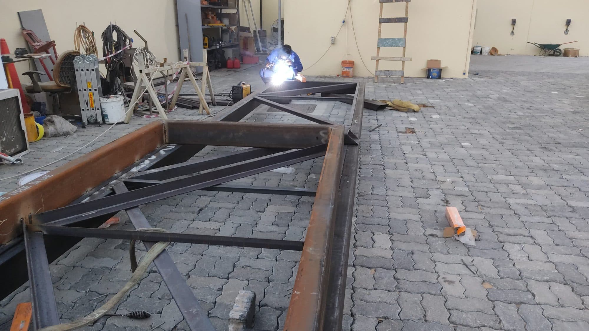 Welding structural steel inside the company’s fabrication facility