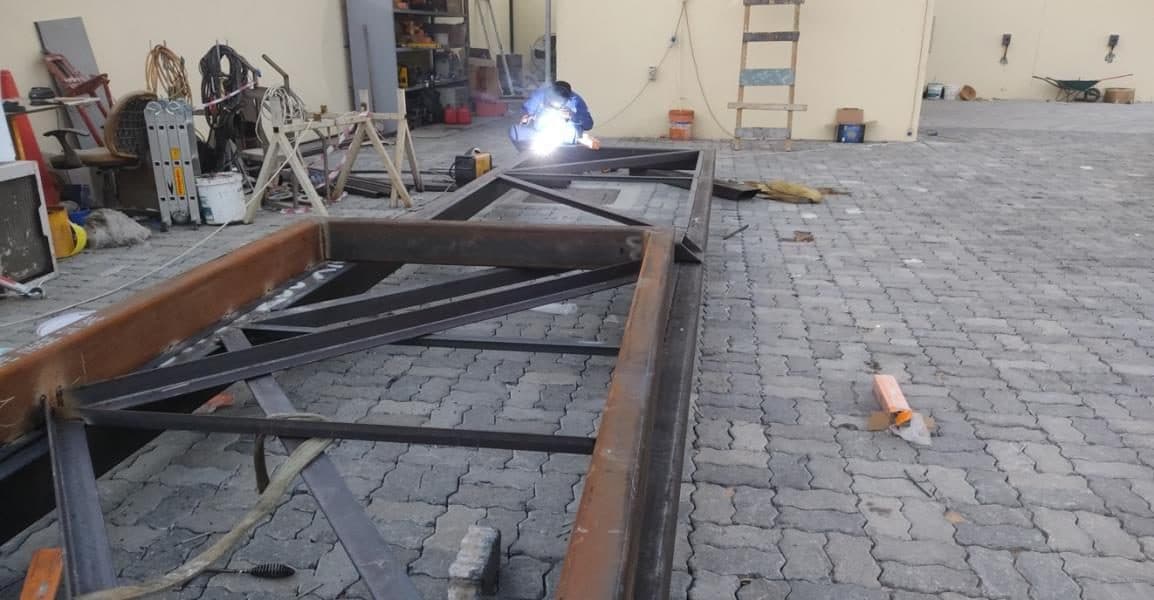 Welding structural steel on site at night