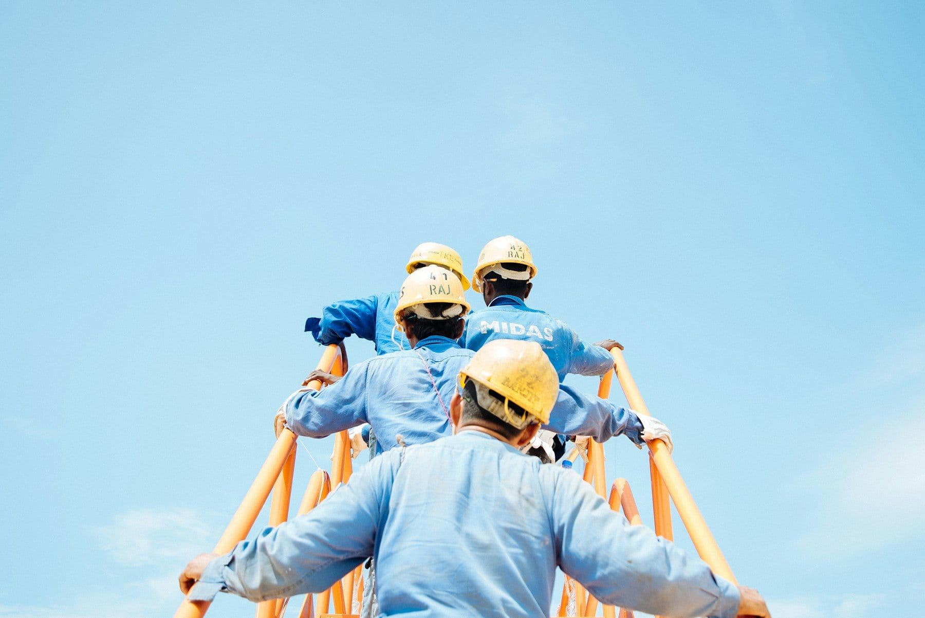 Engineers working at height on a telecom tower