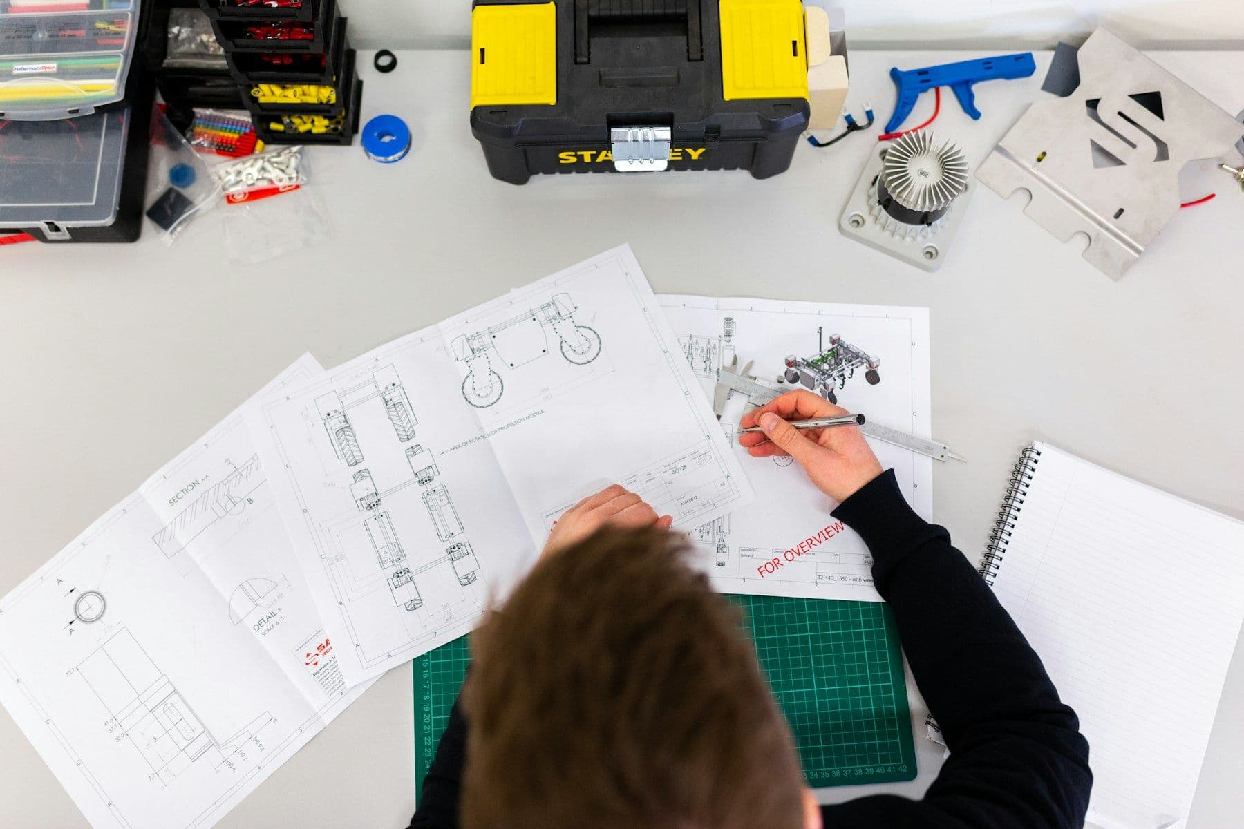 Technical drawings and setting-out tools on a workbench