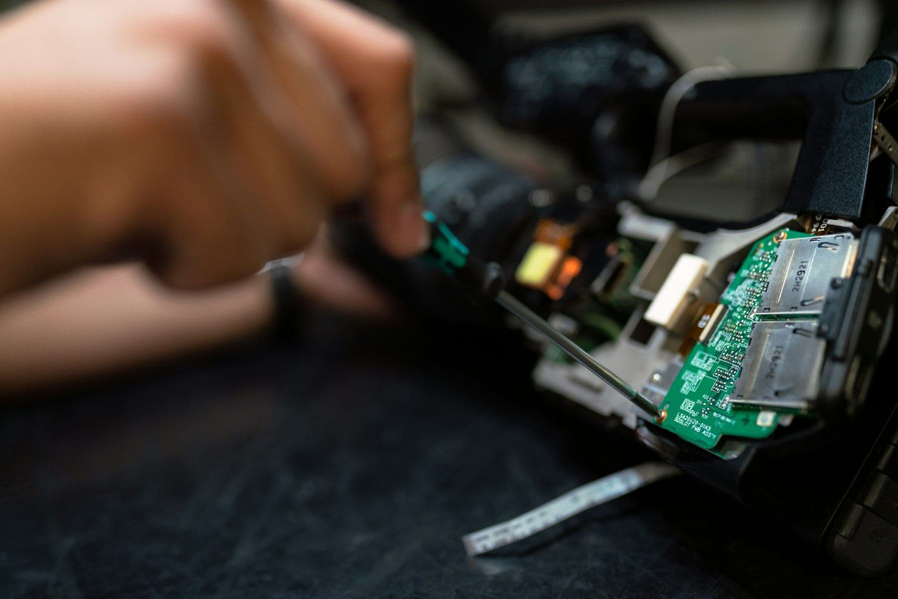 Technician servicing electronic equipment at a site